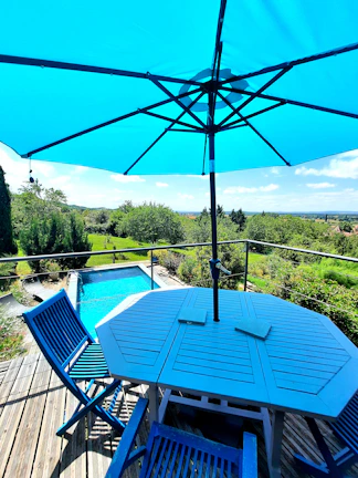 Patio area sparkling clean with wet stone reflecting the blue sky.