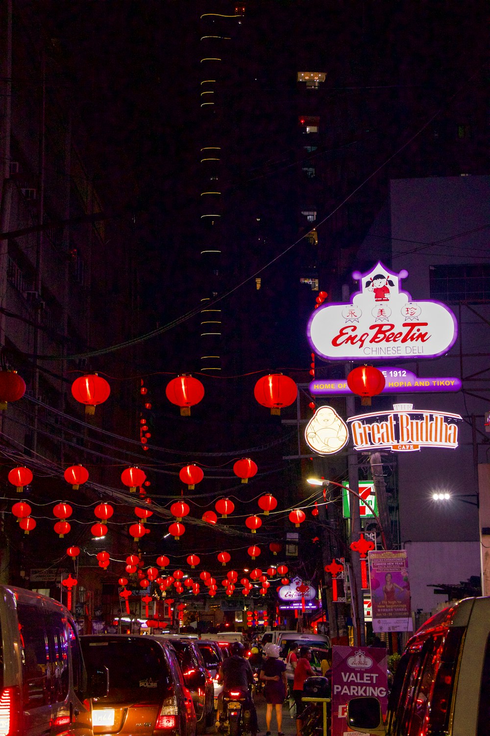 a city street filled with lots of red lanterns