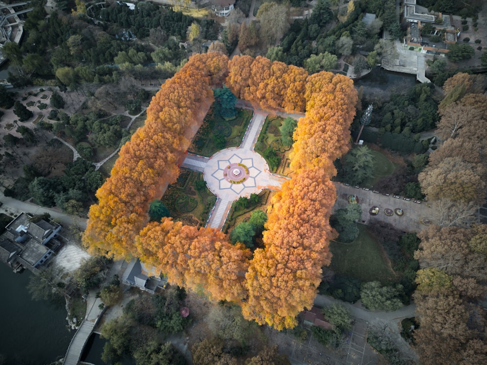 an aerial view of a park surrounded by trees