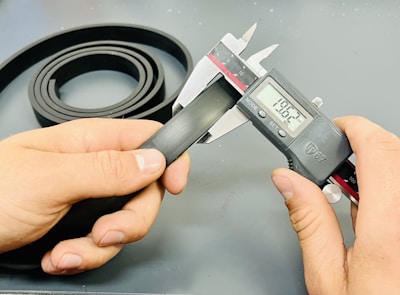 a person is holding VERNIER