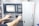 A person operates a control panel with various buttons, switches, and a digital screen displaying data. The background features a machine labeled AFINIS EXPRESS.