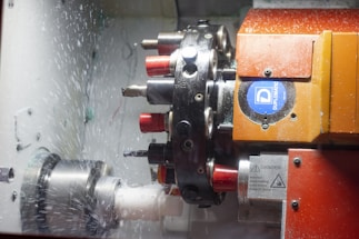 a close up of a machine cutting a piece of metal