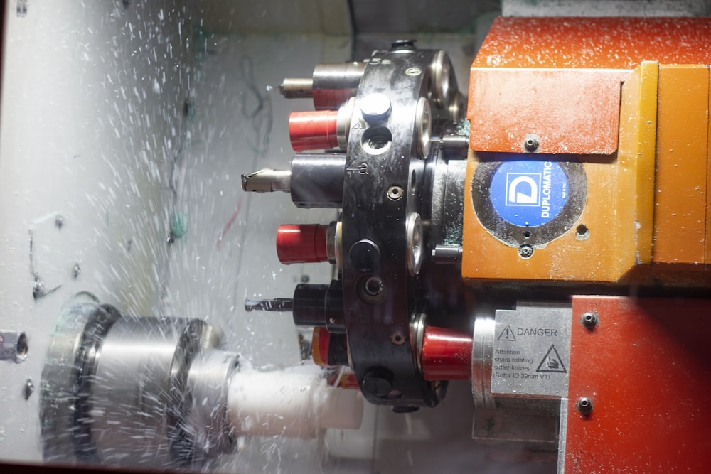 a close up of a machine cutting a piece of metal
