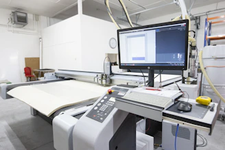 a computer monitor sitting on top of a machine
