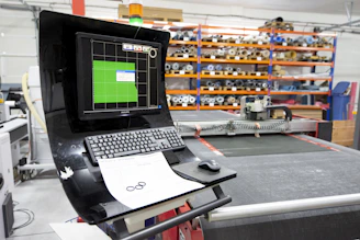 a laptop computer sitting on top of a table