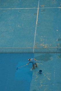 a man with a tennis racquet on a tennis court