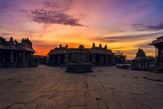 Sunset casting golden light on the ancient stone steps leading to one of the Panch Kedar temples.