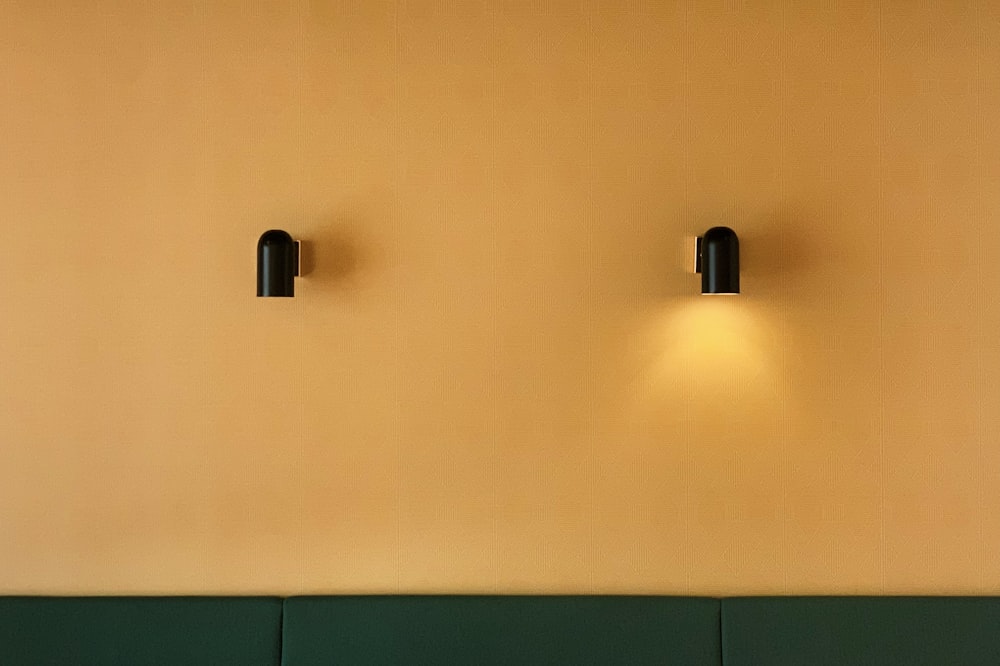 a couple of lights that are on the side of a wall