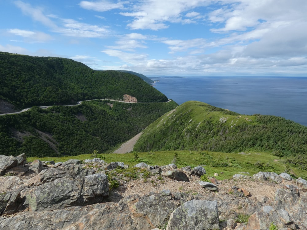 a scenic view of the ocean and mountains