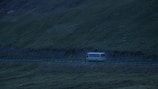 A bus on a scenic route during a journey.