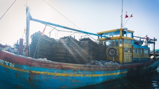 A modern fishing vessel at sunrise, ready to bring in the day’s catch.