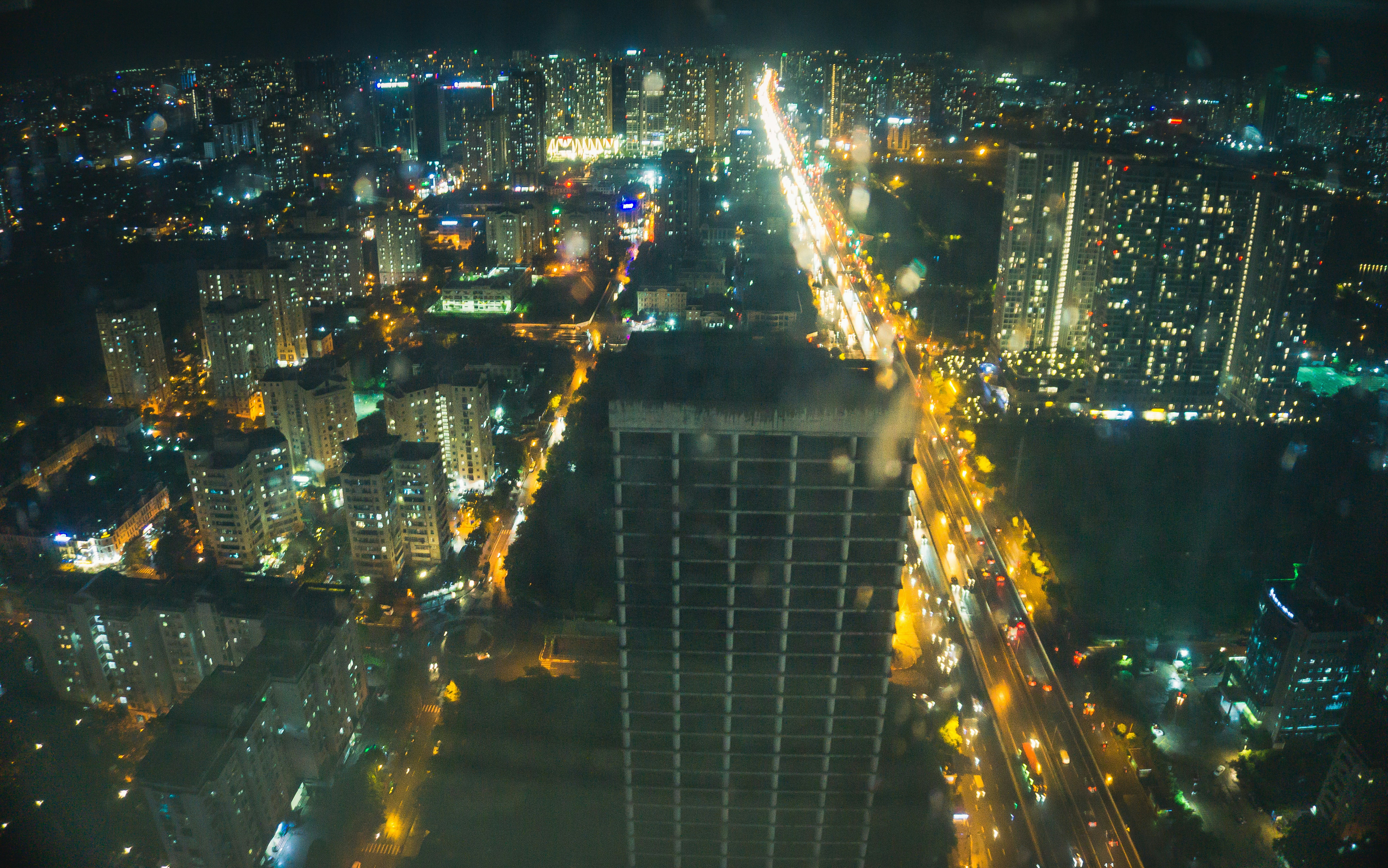 an aerial view of a city at night