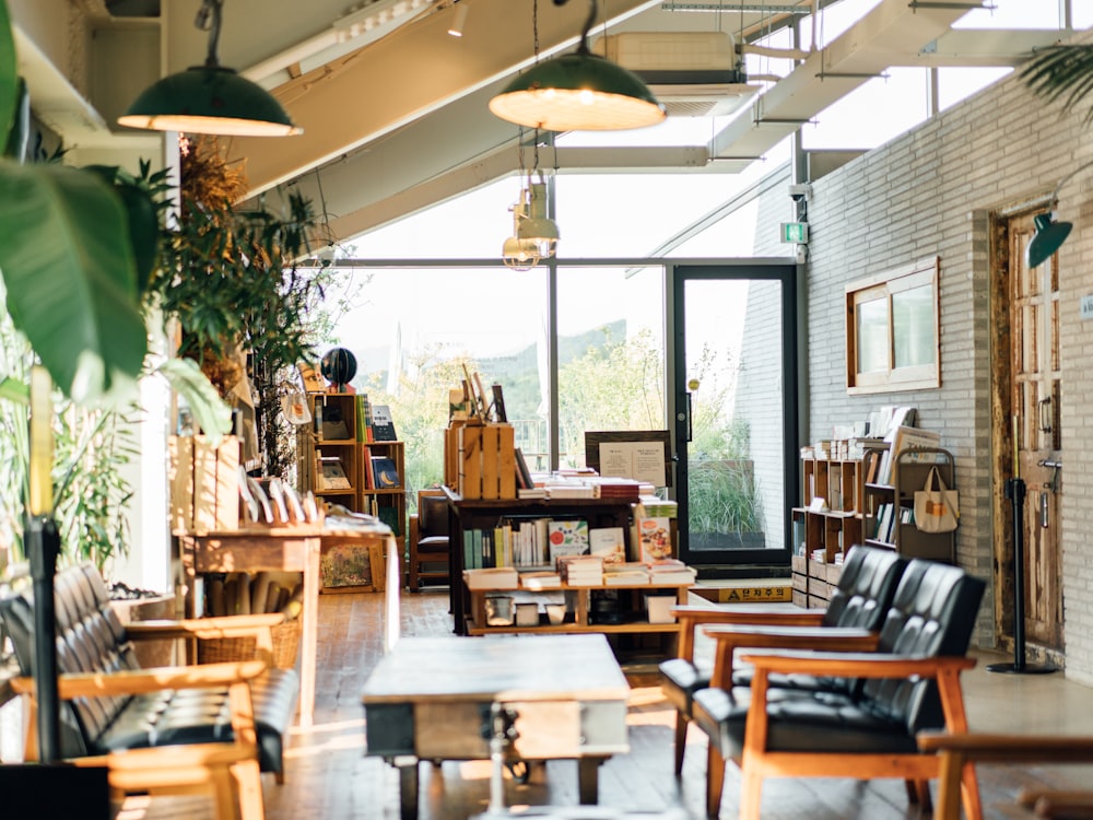 a room filled with lots of furniture and plants