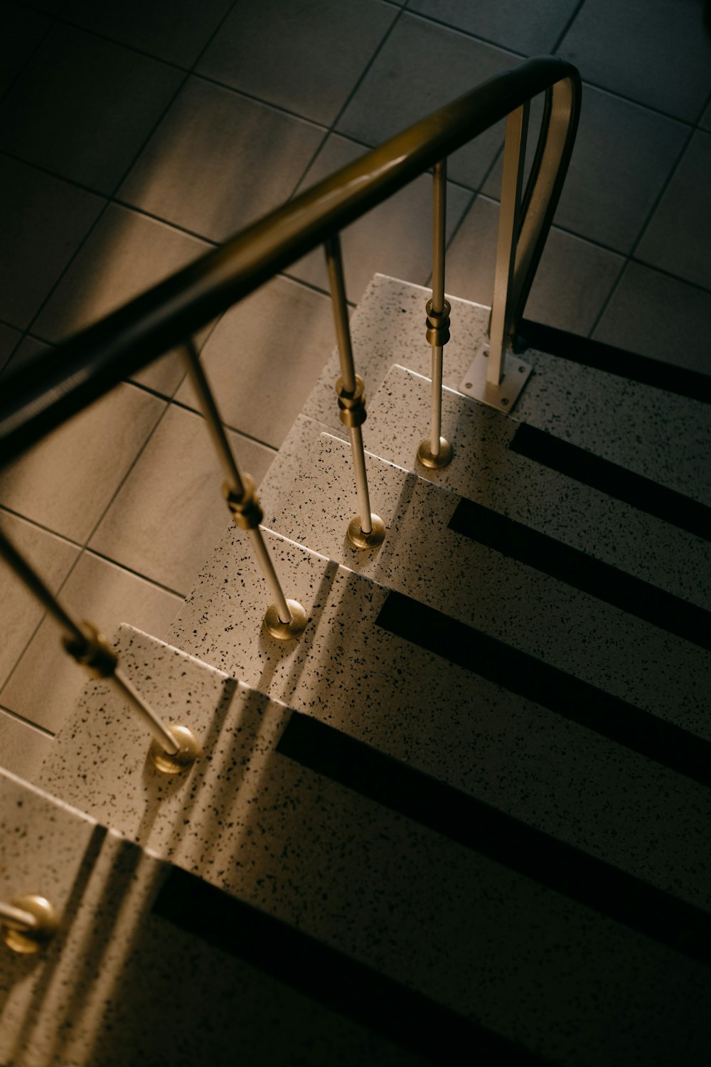 a set of stairs leading up to a tiled floor