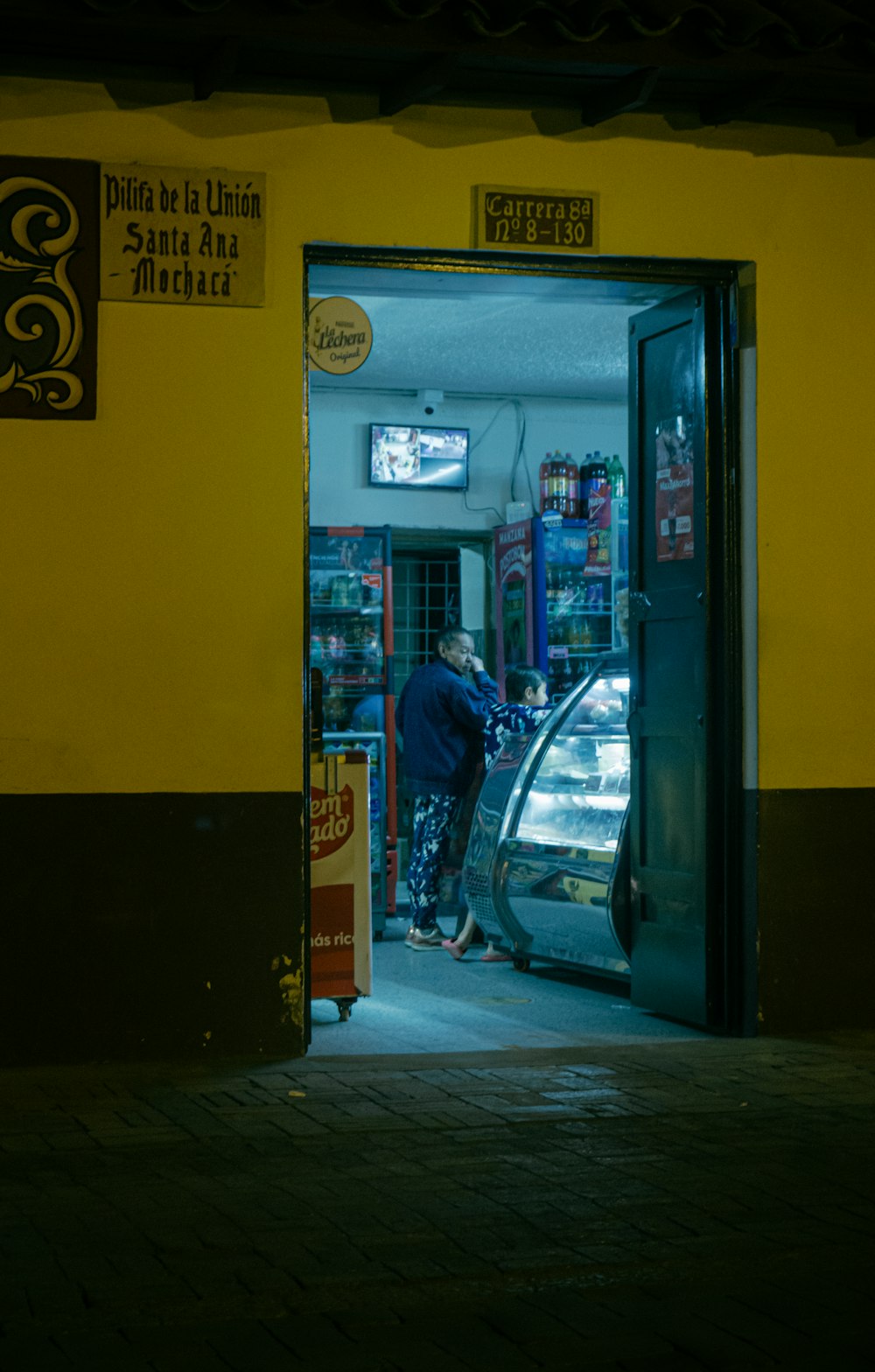a man opening a car door at night