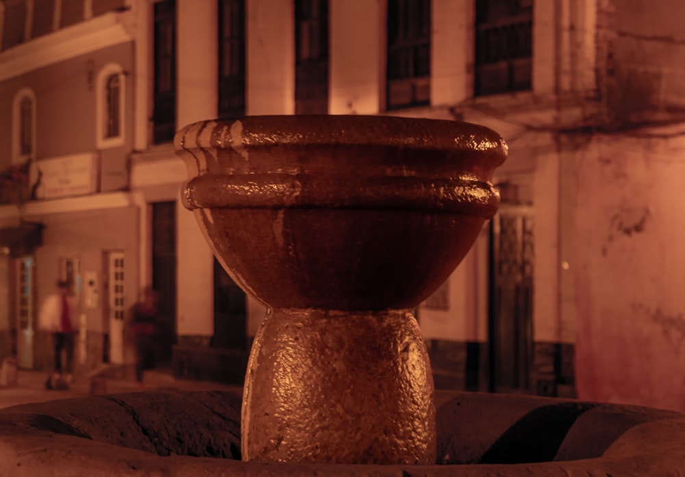 a close up of a fountain on a city street