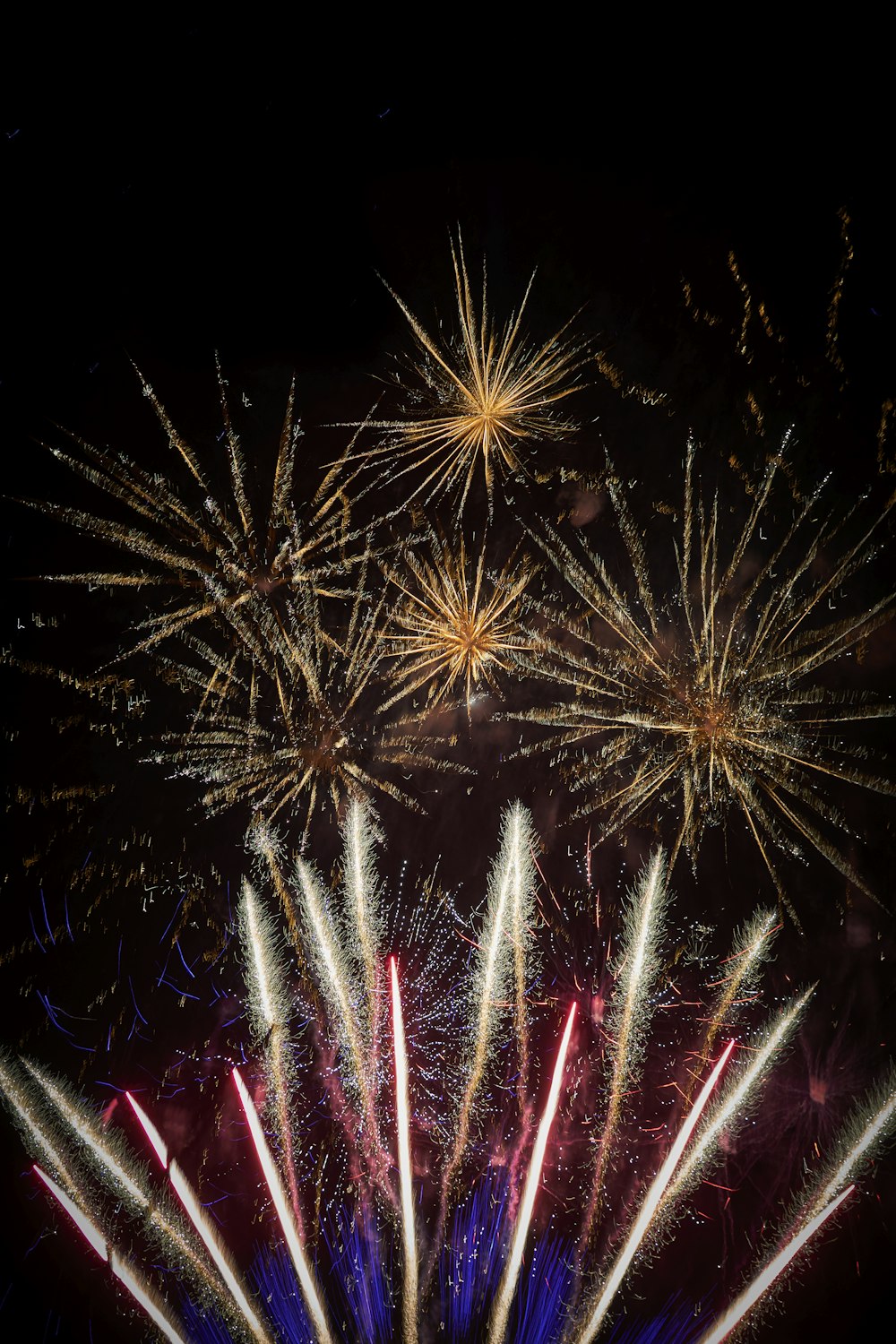 a bunch of fireworks are lit up in the night sky