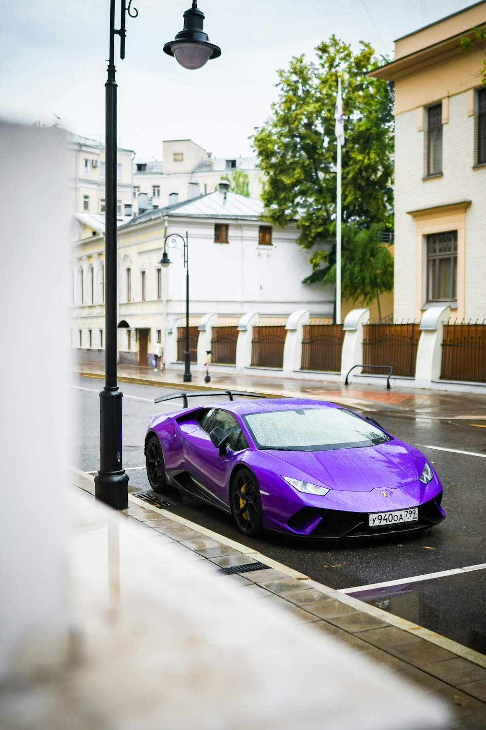 a purple sports car parked in a parking lot