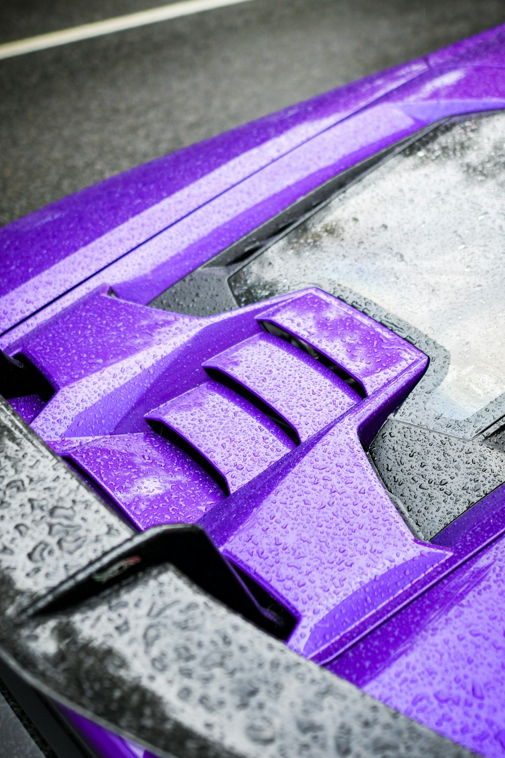 a close up of a purple sports car