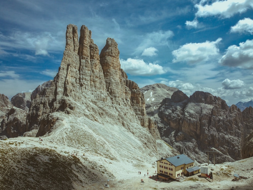 a house in the middle of a mountain range