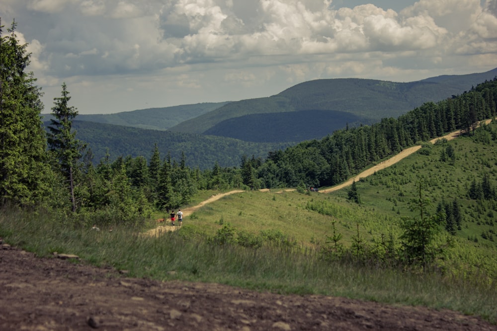 a person riding a motorcycle on a dirt road