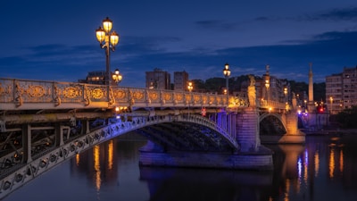 a bridge over a body of water at night