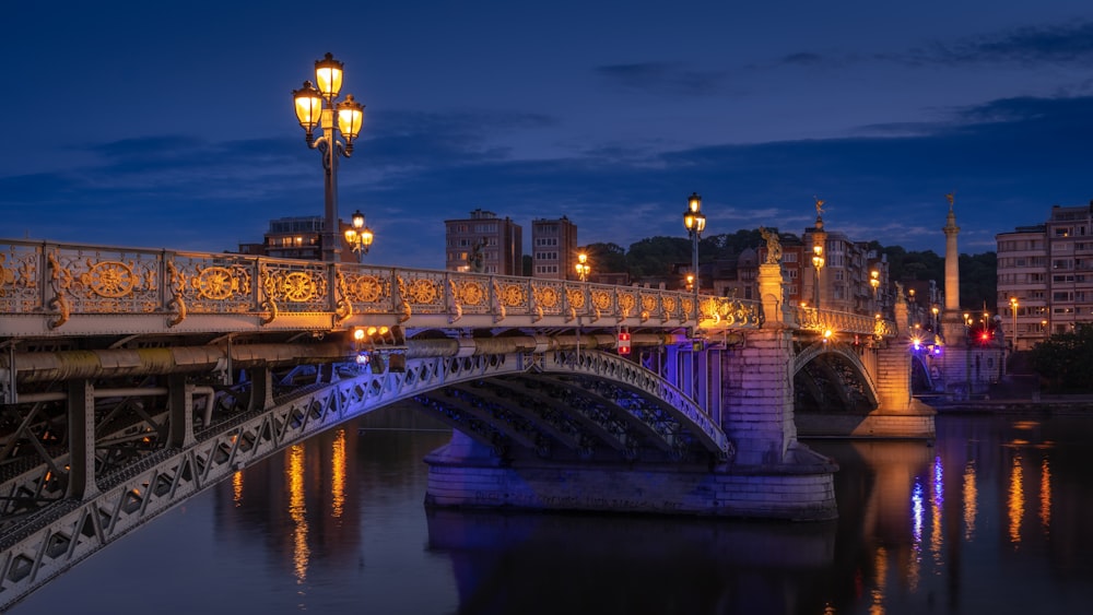 a bridge over a body of water at night