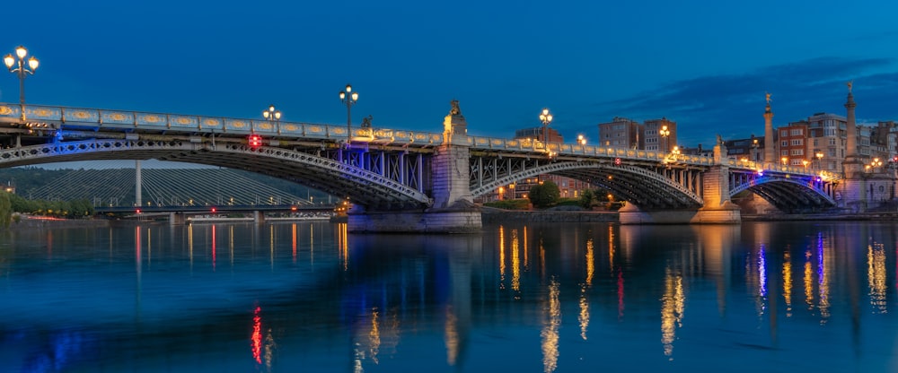 a bridge over a body of water at night