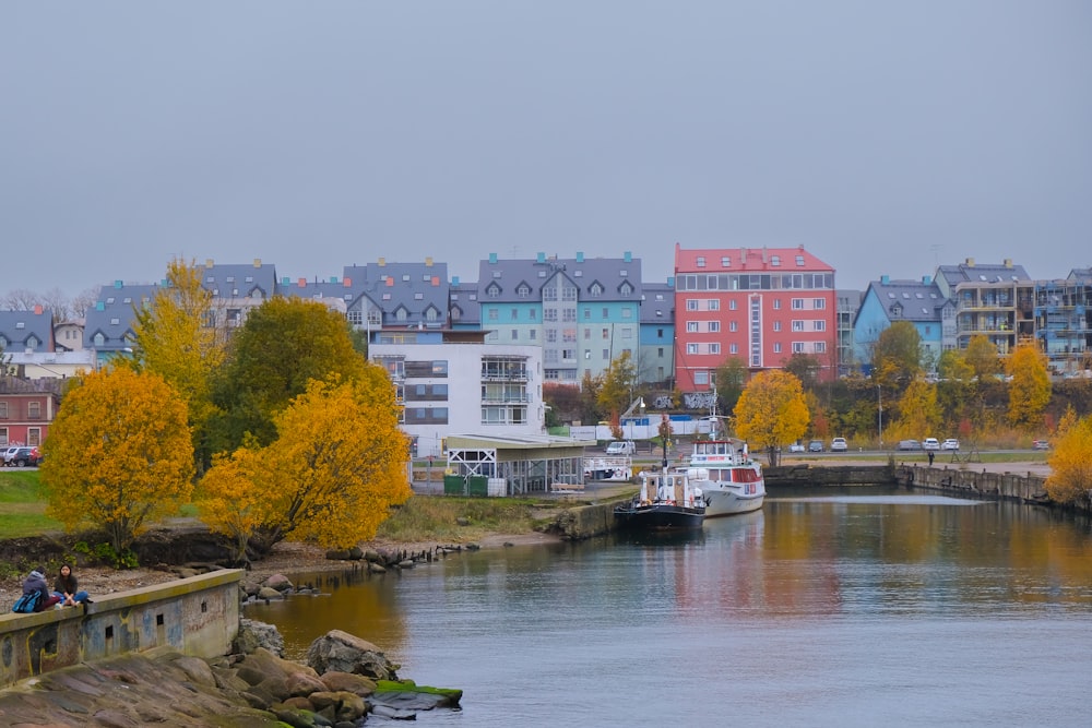 a body of water surrounded by buildings and trees