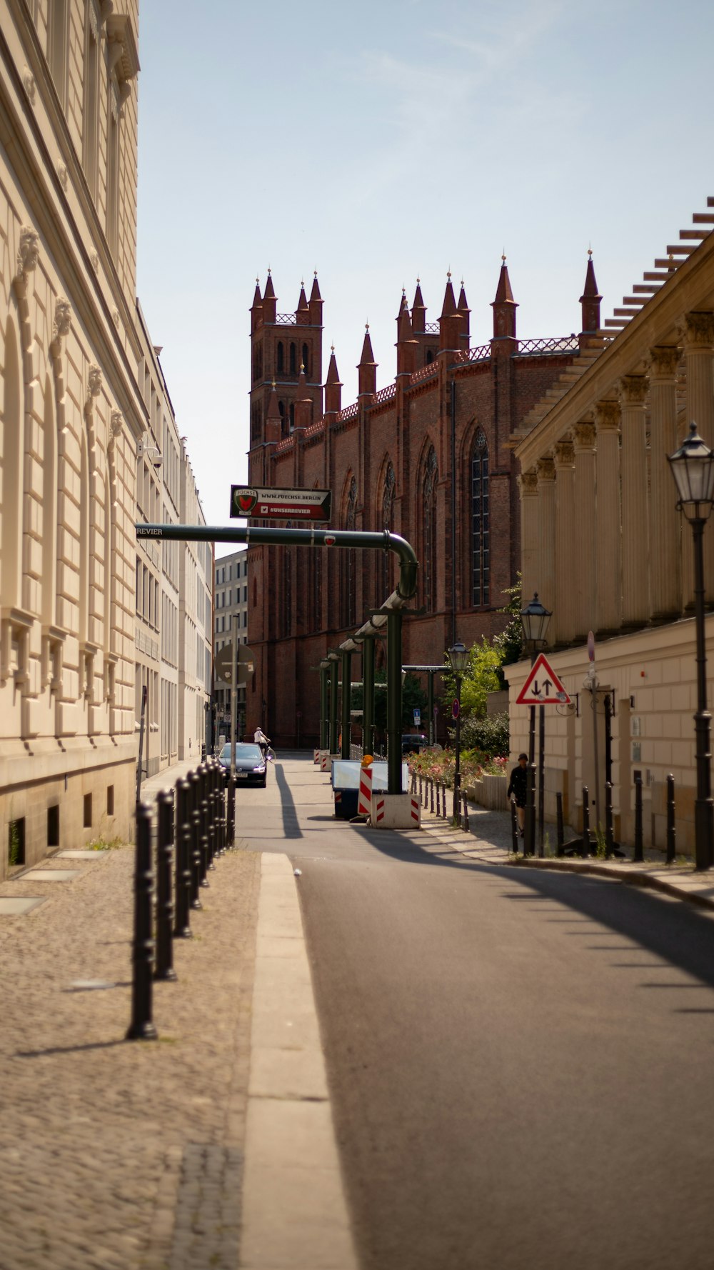 a city street with a church in the background