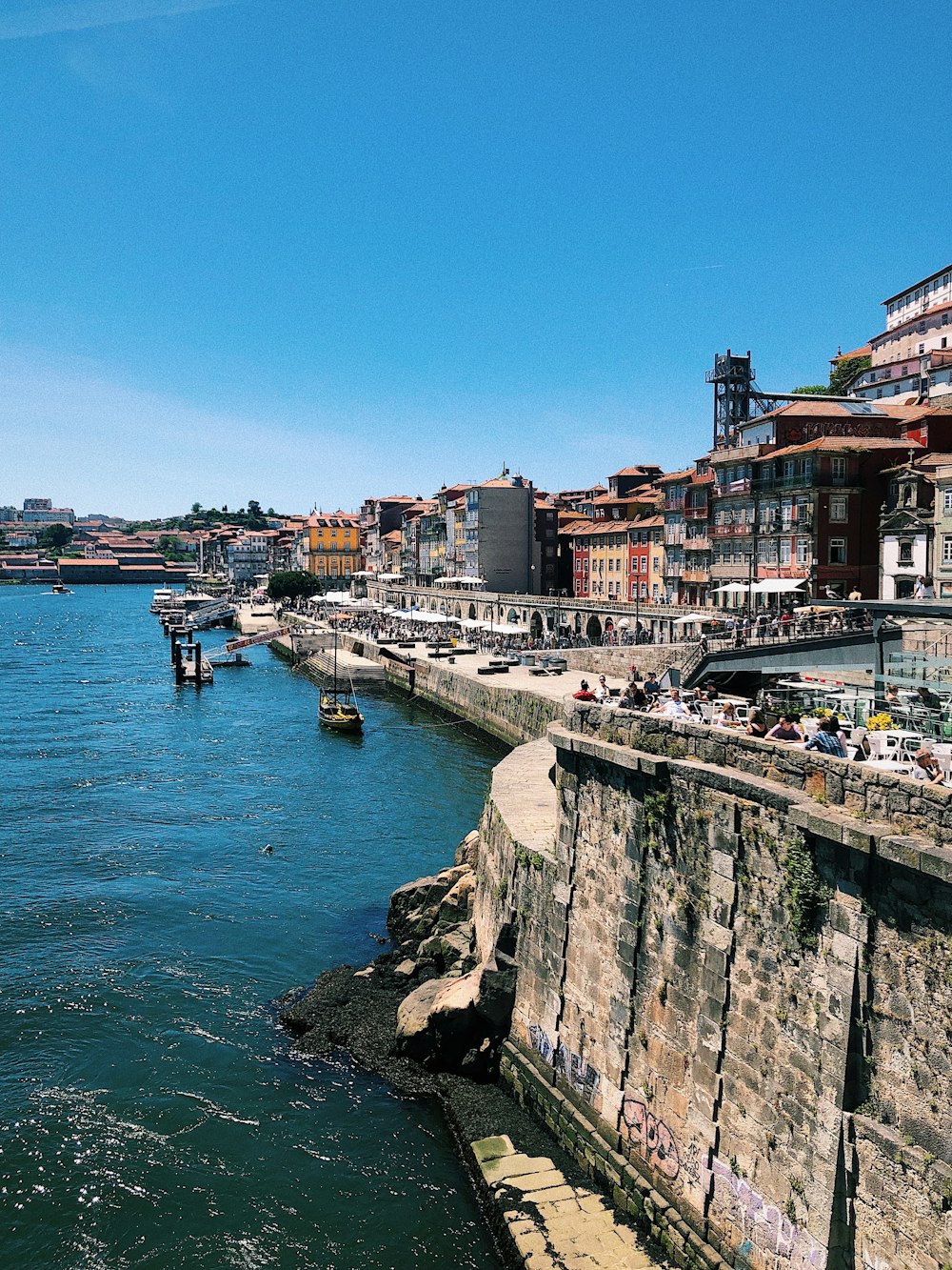 a body of water with a bunch of buildings in the background