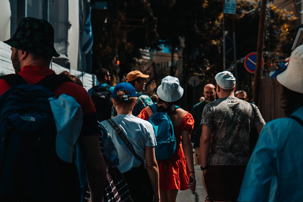 a group of people walking down a street