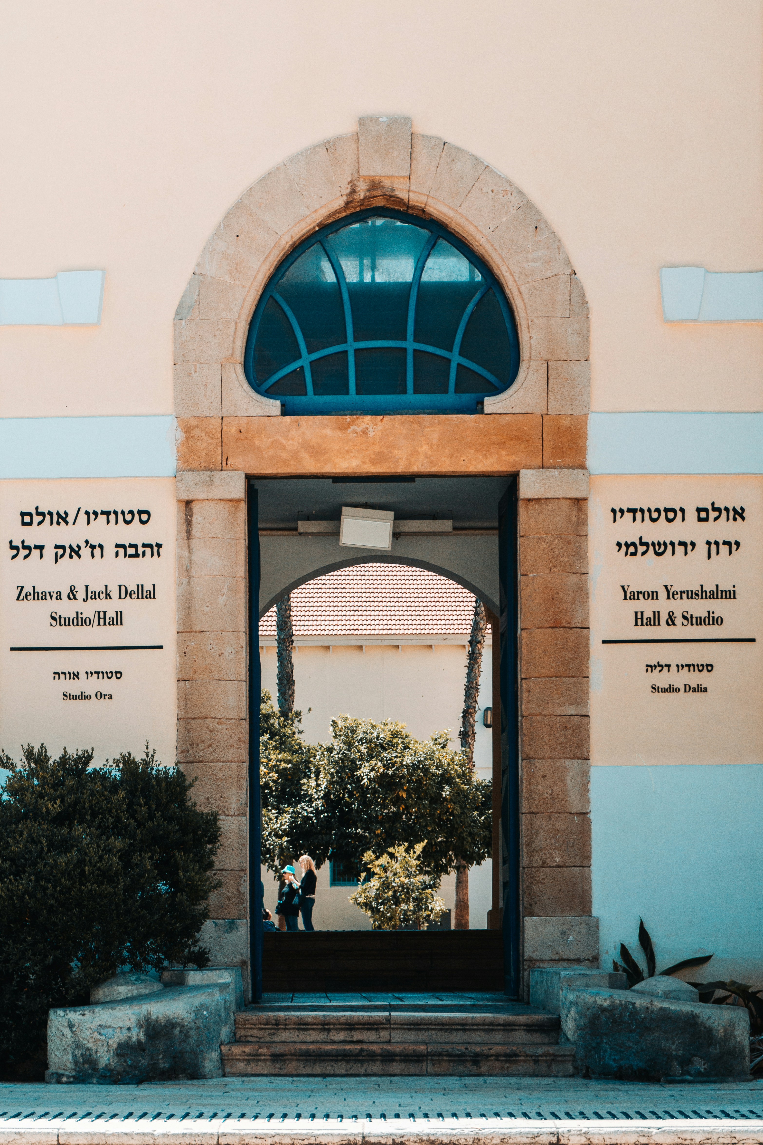 a man standing in a doorway of a building