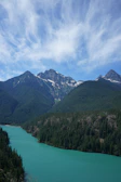 Crystal-clear waters of Morskie Oko framed by rugged mountain peaks under a dramatic sky.