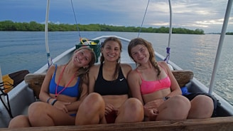 A happy family enjoying their time on a boat.