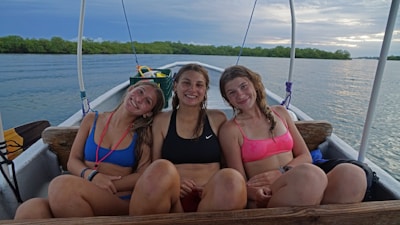 A happy family enjoying their time on a boat.