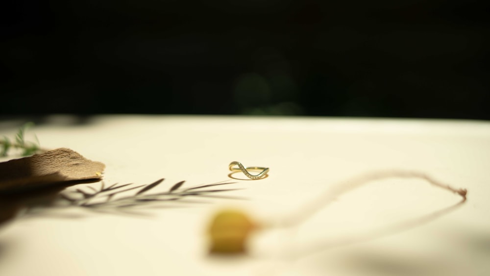 a pair of earrings sitting on top of a table