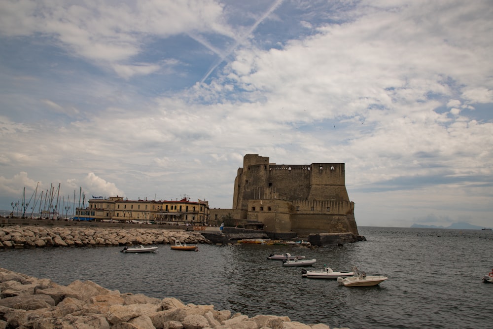 a body of water with a castle in the middle of it