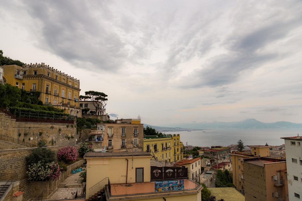 a view of some buildings and a body of water