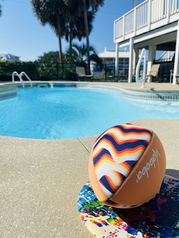 Vibrant painted ball with intricate patterns resting on a soft fabric