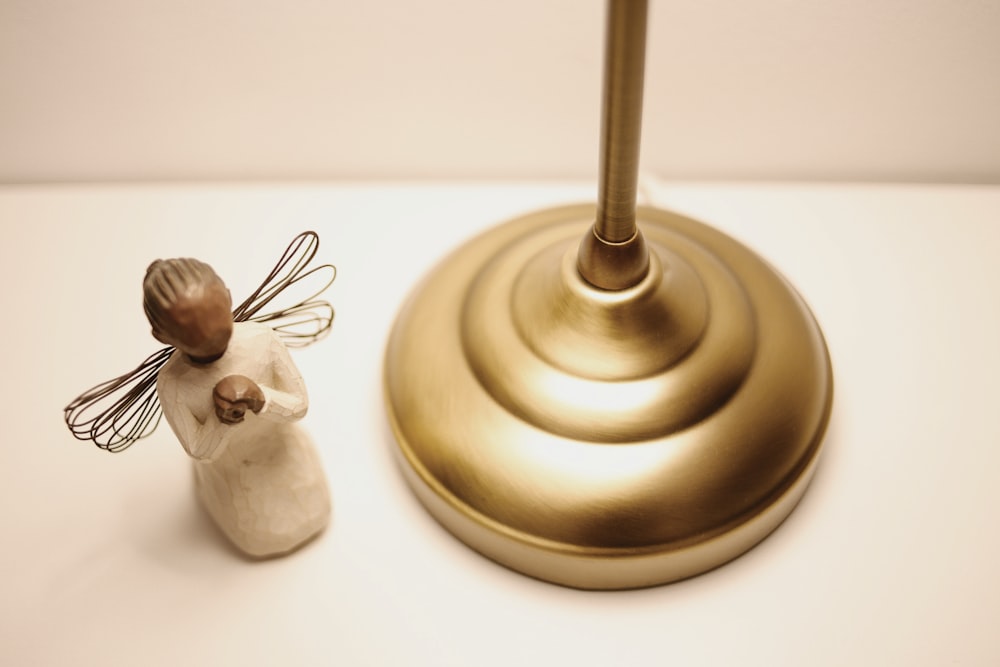 a small figurine of a fairy on a table