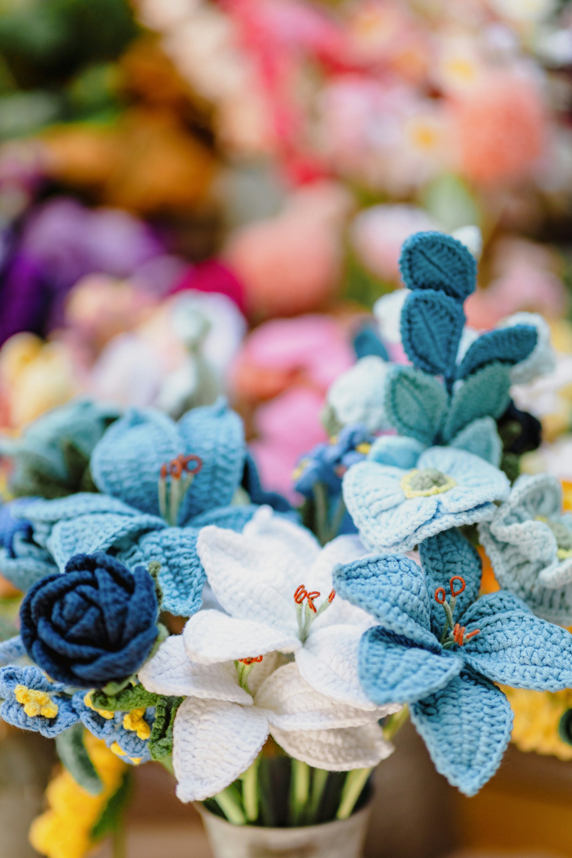 a vase filled with blue and white flowers