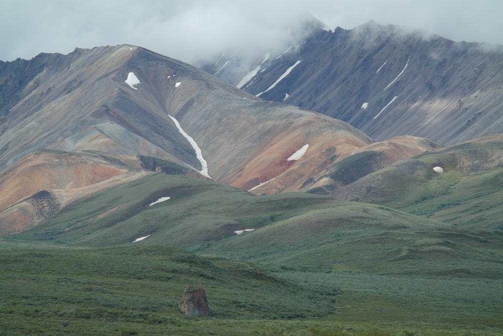 a group of mountains with snow on them