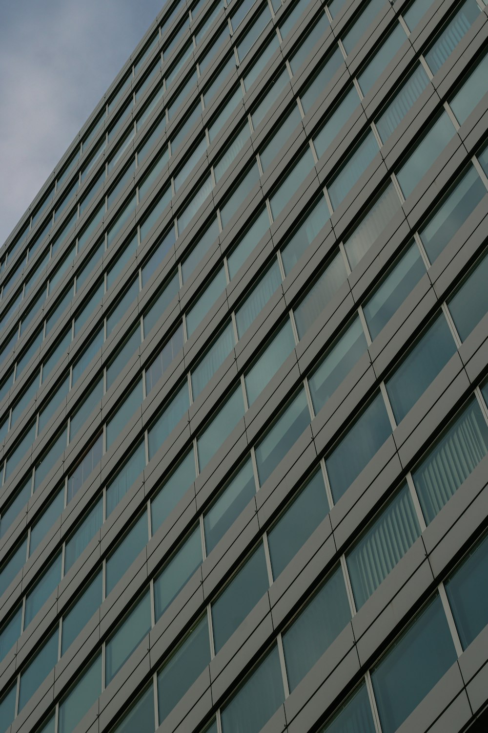 a tall building with lots of windows and a clock