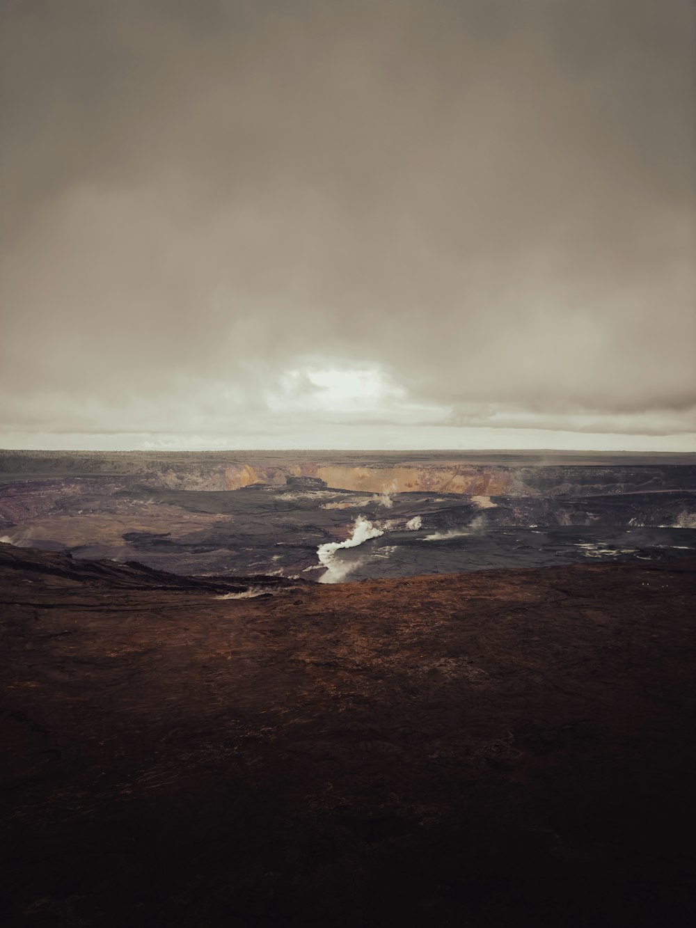 a large body of water sitting under a cloudy sky