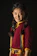 Portrait of a smiling young woman in Misira village, wearing traditional clothing.