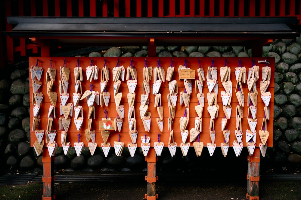 a display of wooden boats on display in front of a wall