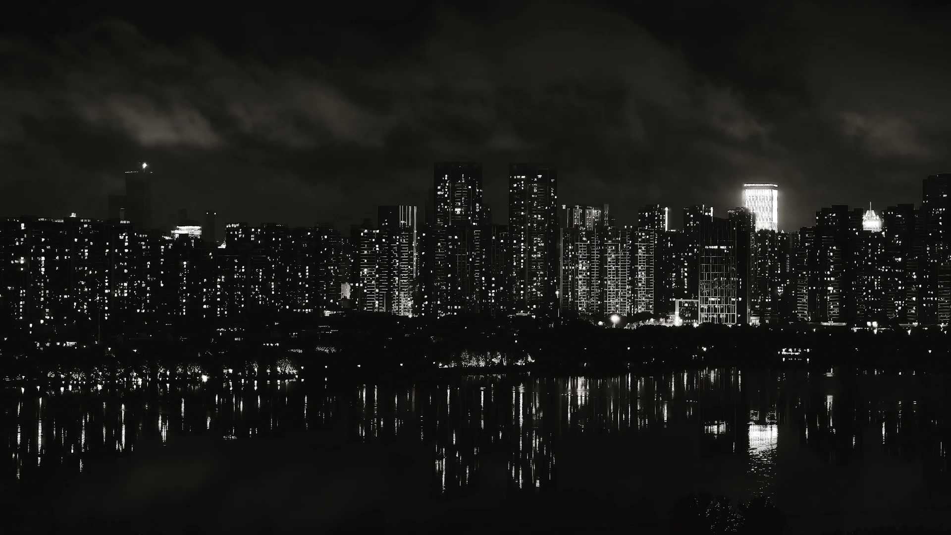 A moody, dark-themed photo of a city skyline at night with glowing lights reflecting on wet streets.