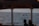 A group of people on a boat watching whales in the ocean.