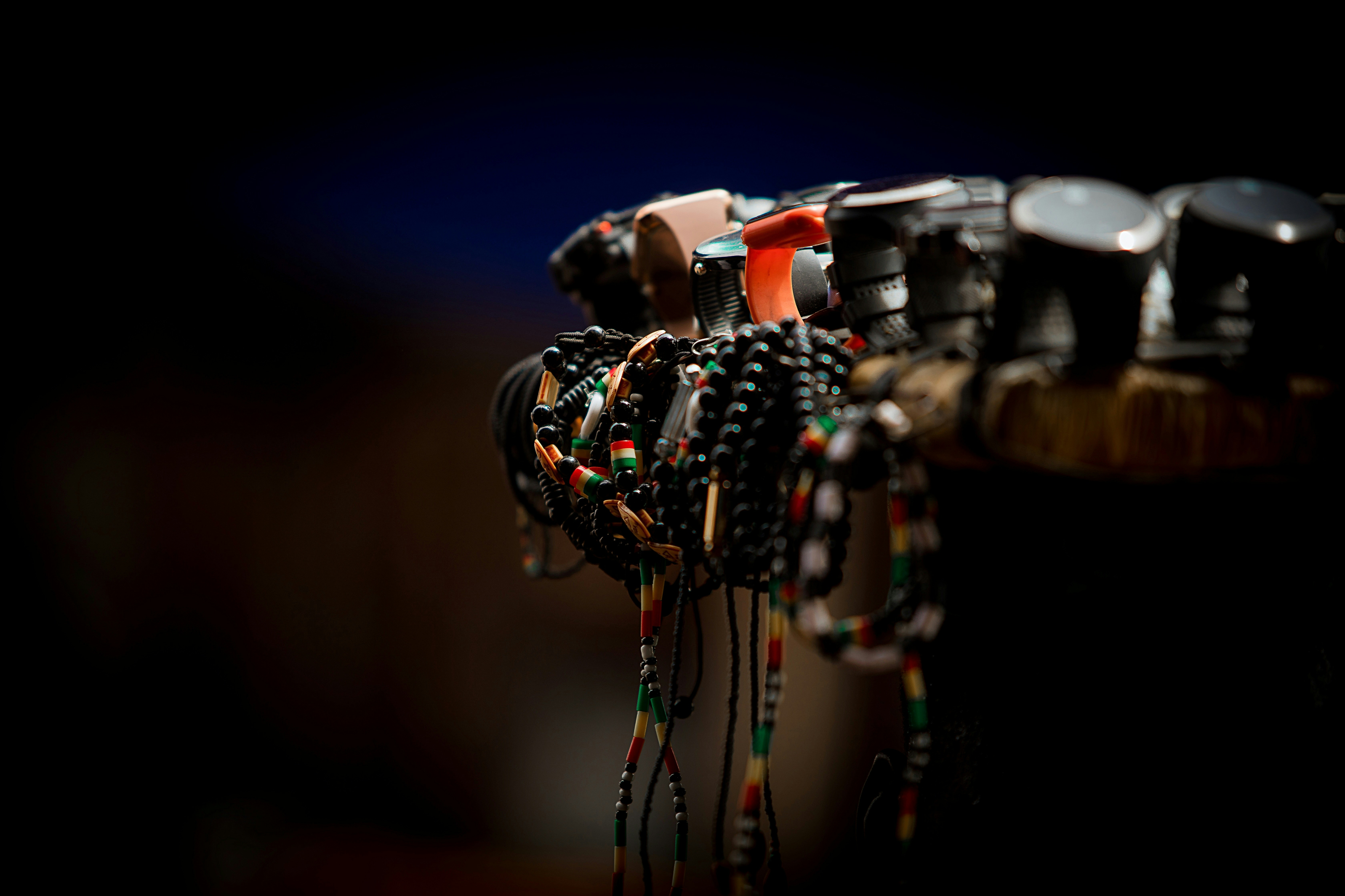 a bunch of bracelets are hanging on a rack